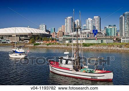 Ships in front of the BC Place Stadium and the skyline of Vancouver, British Columbia, Canada View Large Photo Image Stock Image - Ships in front of the BC Place Stadium and the skyline of Vancouver, British Columbia, Canada. Fotosearch