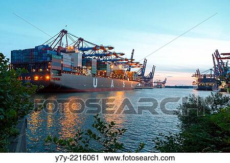 Ships moored at the Eurogate and Burchardkai container terminals in the port of Hamburg, Germany, at sunset in summer View Large Photo Image Stock Image - Ships moored at the Eurogate and Burchardkai container terminals in the port of Hamburg, Germany, at sunset in summer. Fotosearch
