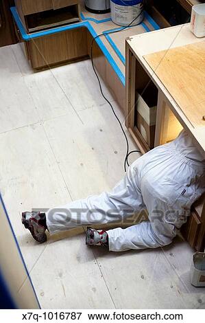 Shipyard worker inside yacht cabin working in carpentry details View Large Photo Image Stock Photo - Shipyard worker inside yacht cabin working in carpentry details. Fotosearch