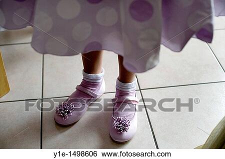Stock Photograph - shoes of little girl before wedding. Fotosearch