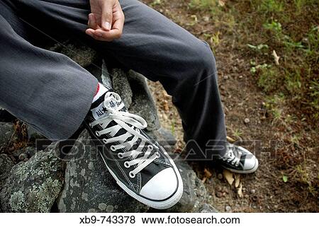 Stock Photo - Shoes on a wall. Fotosearch