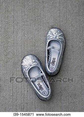 shoes placed by a child on cement. View Large Photo Image Stock Image - shoes placed by a child on cement.. Fotosearch
