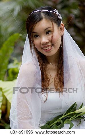 Shooting model in bridal wear at Santubong Resorts, Kuching, Sarawak, Malaysia. View Large Photo Image Stock Photograph - Shooting model in bridal wear at Santubong Resorts, Kuching, Sarawak, Malaysia.. Fotosearch