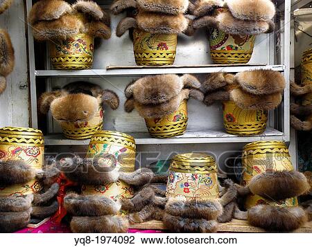 Stock Image - Shop of caps in Jokhang Temple, Lhasa, Tibet, Asia. Fotosearch