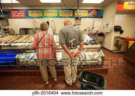 Shoppers browse seafood at the Fairway supermarket in the Chelsea neighborhood of New York on its grand opening day. View Large Photo Image Picture - Shoppers browse seafood at the Fairway supermarket in the Chelsea neighborhood of New York on its grand opening day.. Fotosearch