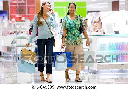 Shopping and talking View Large Photo Image Stock Photo - Shopping and talking. Fotosearch