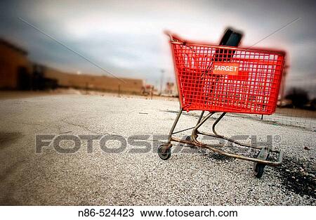 Shopping cart in parking lot View Large Photo Image Stock Image - Shopping cart in parking lot. Fotosearch