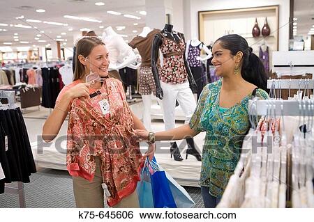 Shopping for new clothes View Large Photo Image Stock Photograph - Shopping for new clothes. Fotosearch