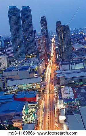 Stock Photography - Shopping malls, commercial high rise buildings and residential housing in Mandaluyong City metro manila philippines. Fotosearch
