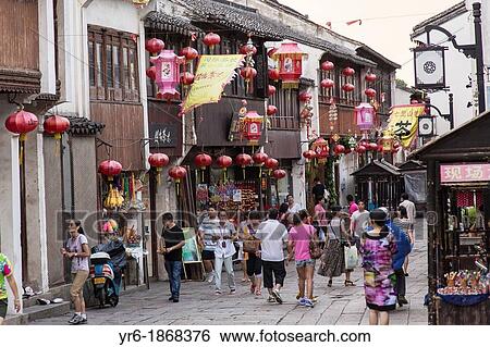Stock Photograph - Shops and tourists in the Shantang Road area in Suzhou, China. Fotosearch
