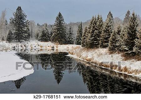 Stock Image - Shoreline of Junction Creek in early winter, Greater Sudbury Lively, Ontario, Canada. Fotosearch