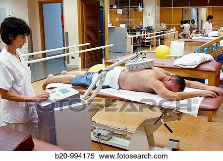 Stock Photography - Short wave, anti-inflammatory electrotherapy, rebahilitation. Policlinica Gipuzkoa, San Sebastian, Donostia, Euskadi, Spain. Fotosearch