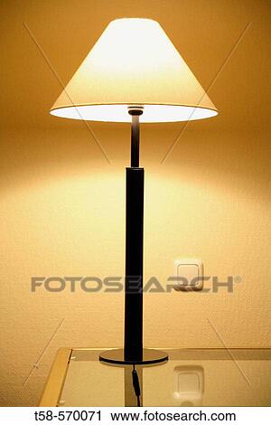 shot of a lamp on a coffee table View Large Photo Image Stock Image - shot of a lamp on a coffee table. Fotosearch