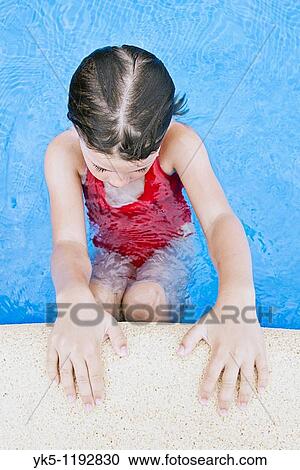 Stock Image - Shot of a Young Child Poolside. Fotosearch