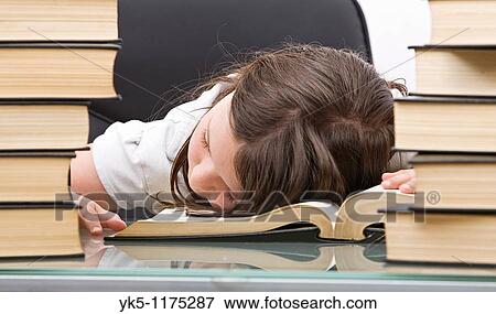 Shot of a Young School Child Asleep at her Desk View Large Photo Image Stock Photo - Shot of a Young School Child Asleep at her Desk. Fotosearch