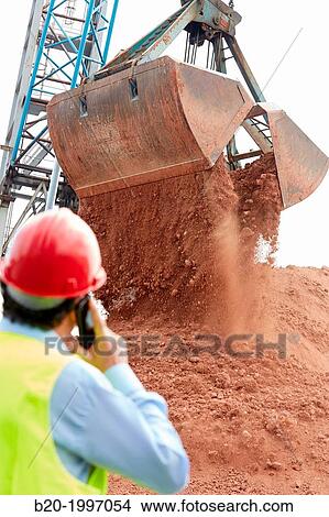 Shovel. Scoop. Bentonite discharge. Pasajes Port, Gipuzkoa, Basque Country, Spain. View Large Photo Image Picture - Shovel. Scoop. Bentonite discharge. Pasajes Port, Gipuzkoa, Basque Country, Spain.. Fotosearch