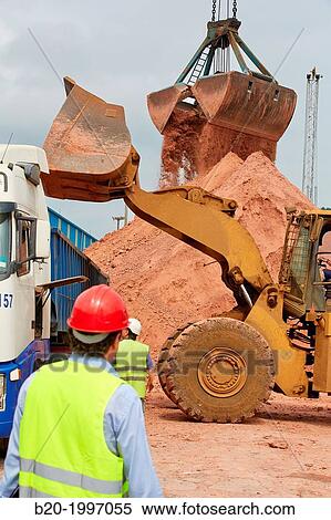 Stock Photography - Shovel. Scoop. Bentonite discharge. Pasajes Port, Gipuzkoa, Basque Country, Spain.. Fotosearch