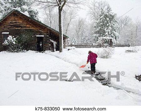 Stock Image - shoveling snow. Fotosearch