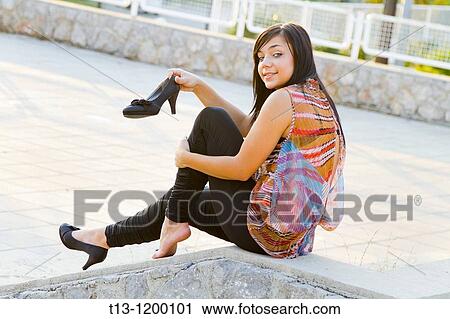 Showing a stilleto shoe young woman View Large Photo Image Stock Image - Showing a stilleto shoe young woman. Fotosearch