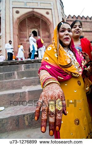 Stock Photo - Showing off her Henna and rings.. Fotosearch