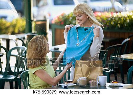 Showing off new purchase to friend. View Large Photo Image Stock Photo - Showing off new purchase to friend.. Fotosearch