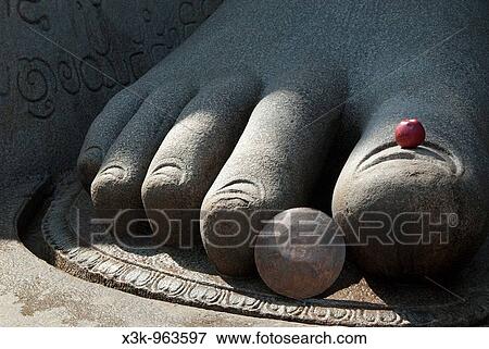 Shravanabelagola, Karnataka, India Detail of granite foot with apple offering on toe Shravanabelagola is a sacred temple city and pilgrimage site for Jaina art, architecture, religion and culture as early as 300 BC View Large Photo Image Stock Photo - Shravanabelagola, Karnataka, India Detail of granite foot with apple offering on toe Shravanabelagola is a sacred temple city and pilgrimage site for Jaina art, architecture, religion and culture as early as 300 BC. Fotosearch