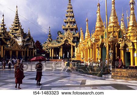 Shrines of the Shwedagon pagoda in the evening light. Yangon, Myanmar View Large Photo Image Stock Image - Shrines of the Shwedagon pagoda in the evening light. Yangon, Myanmar. Fotosearch