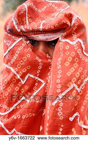 Shy girl looking through her dress in India View Large Photo Image Stock Image - Shy girl looking through her dress in India. Fotosearch