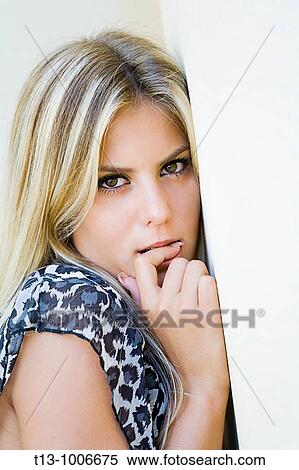 Stock Photography - Shy pretty girl portrait. Fotosearch