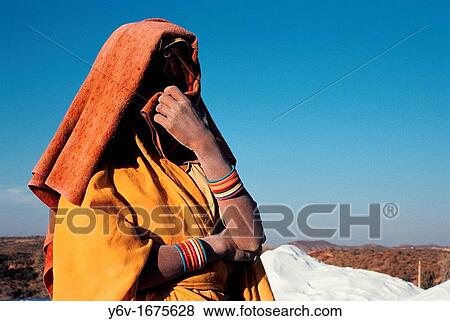 Shy worker in a gypsum quarry. She belongs to the Bhil tribe. From Rajasthan, India. View Large Photo Image Stock Photo - Shy worker in a gypsum quarry. She belongs to the Bhil tribe. From Rajasthan, India.. Fotosearch