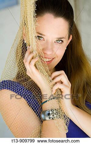 Stock Photo - Shy young woman portrait. Fotosearch