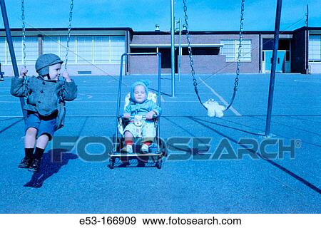 Siblings at elementary school playground. Kansas City. USA View Large Photo Image Stock Photo - Siblings at elementary school playground. Kansas City. USA. Fotosearch