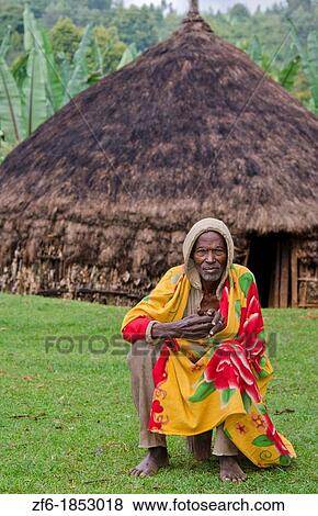 Stock Photo - Sidama Tribe Ethiopia Africa old man age 82 with his hut home with scarf in Lower Omo Valley 30. Fotosearch