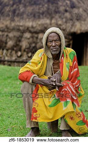 Sidama Tribe Ethiopia Africa old man age 82 with his hut home with scarf in Lower Omo Valley 30 View Large Photo Image Stock Photo - Sidama Tribe Ethiopia Africa old man age 82 with his hut home with scarf in Lower Omo Valley 30. Fotosearch