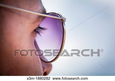 Side of mans face with sunglasses View Large Photo Image Stock Image - Side of mans face with sunglasses. Fotosearch