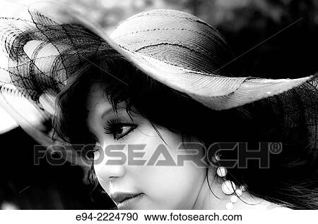 Side view close up portrait of a 38 year old Asian-American woman wearing a black straw hat, black & white. View Large Photo Image Stock Image - Side view close up portrait of a 38 year old Asian-American woman wearing a black straw hat, black & white.. Fotosearch
