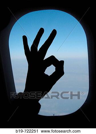 Stock Image - Sign and airplane window. Fotosearch