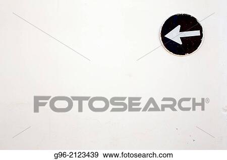 Stock Photo - Sign on a white wall.. Fotosearch