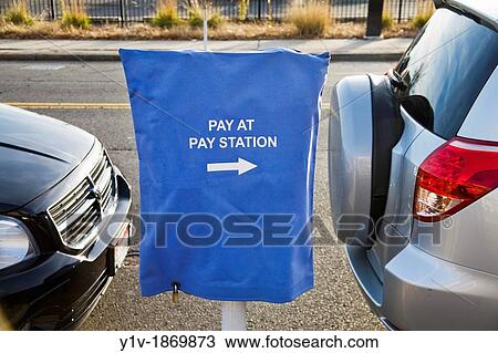 Sign over a parking meter reading,? Pay at pay station? View Large Photo Image Stock Image - Sign over a parking meter reading,? Pay at pay station?. Fotosearch