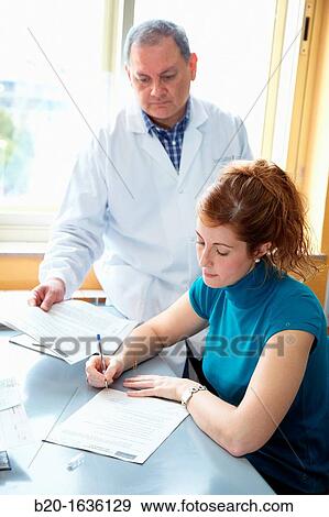 Stock Photo - Signature of informed consent Clinical Trials Unit, Testing in Phase 1, the first drug administration in humans, Pharmacy, Area Health, Researchers Tecnalia Research & Innovation, Txagorritxu Hospital, Vitoria, Gasteiz, Araba, Basque Country, Spain. Fotosearch