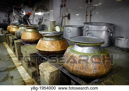 Stock Image - Sikh Temple - kitchen, where is free food prepared, New Delhi, India.. Fotosearch