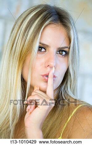 Silence please young woman portrait View Large Photo Image Stock Photo - Silence please young woman portrait. Fotosearch