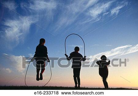 Silhouette jump ropers View Large Photo Image Stock Photo - Silhouette jump ropers. Fotosearch