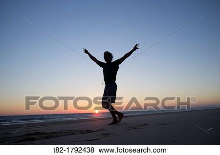 silhouette man jumping on the beach at sunset, Andalusia, Spain, Europe View Large Photo Image Stock Photo - silhouette man jumping on the beach at sunset, Andalusia, Spain, Europe. Fotosearch