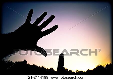 Silhouette of a hand in the sky View Large Photo Image Stock Photo - Silhouette of a hand in the sky. Fotosearch
