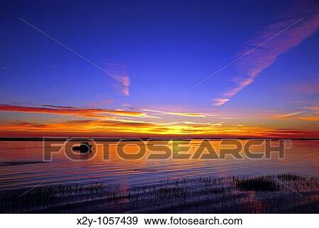 Silhouette of a lobster boat in harbor, Nauset Harbor, East Orleans, Cape Cod, Massachusettes View Large Photo Image Stock Photo - Silhouette of a lobster boat in harbor, Nauset Harbor, East Orleans, Cape Cod, Massachusettes. Fotosearch