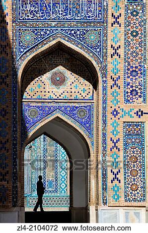 Stock Image - Silhouette of a man in the Shah-i-Zinda necropolis. Uzbekistan, Samarkand.. Fotosearch