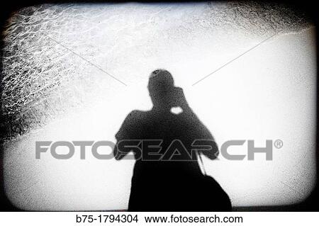 silhouette of a man self-portrait photographer taking a picture View Large Photo Image Picture - silhouette of a man self-portrait photographer taking a picture. Fotosearch