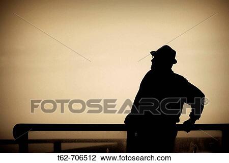 Silhouette of a man with backlight, resting View Large Photo Image Stock Image - Silhouette of a man with backlight, resting. Fotosearch