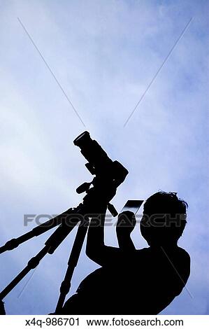 silhouette of a photographer View Large Photo Image Stock Image - silhouette of a photographer. Fotosearch